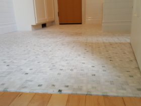 Marble mosaic floor tile installation
